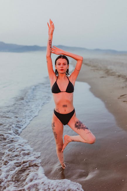 A woman in a peaceful yoga meditation pose with a serene expression.
